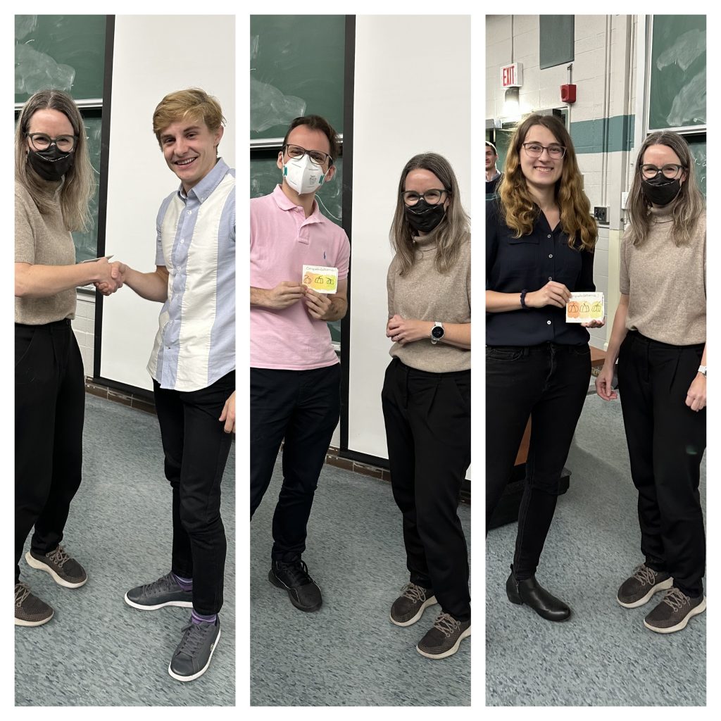 Physics and Astronomy Symposium Day winners Cameron Burns, Daniel Dobrowolski and Nicole Gromek with professor Laura Parker